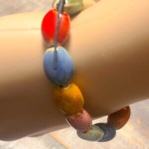Circle of Beautiful Stones On Black Plastic Stretch Elastic